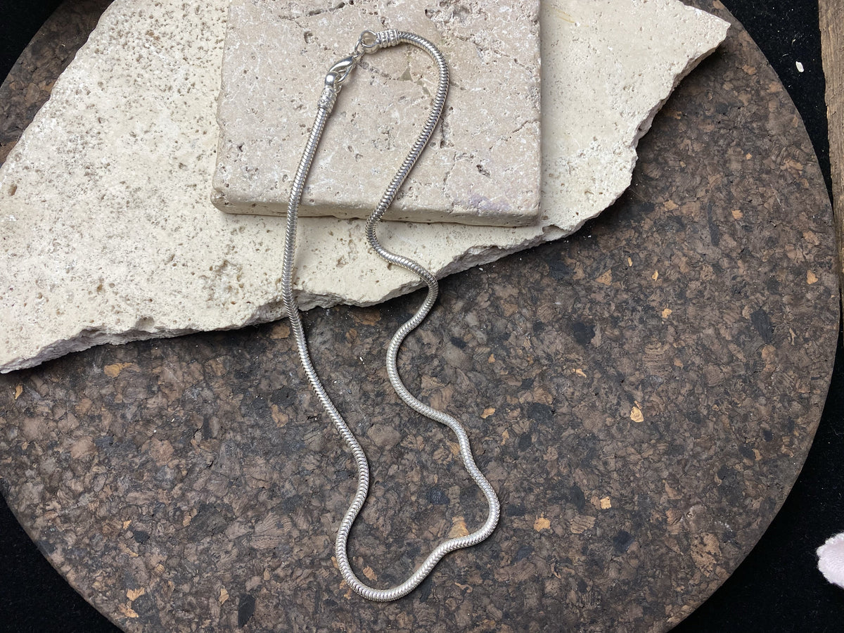 Silver-look open weave snake chain is light and strong, with a bright silver finish and lobster clasp