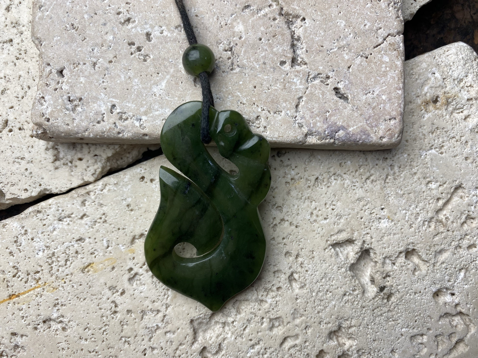 Stunning natural light green veined jade Maori guardian Manaia pendant