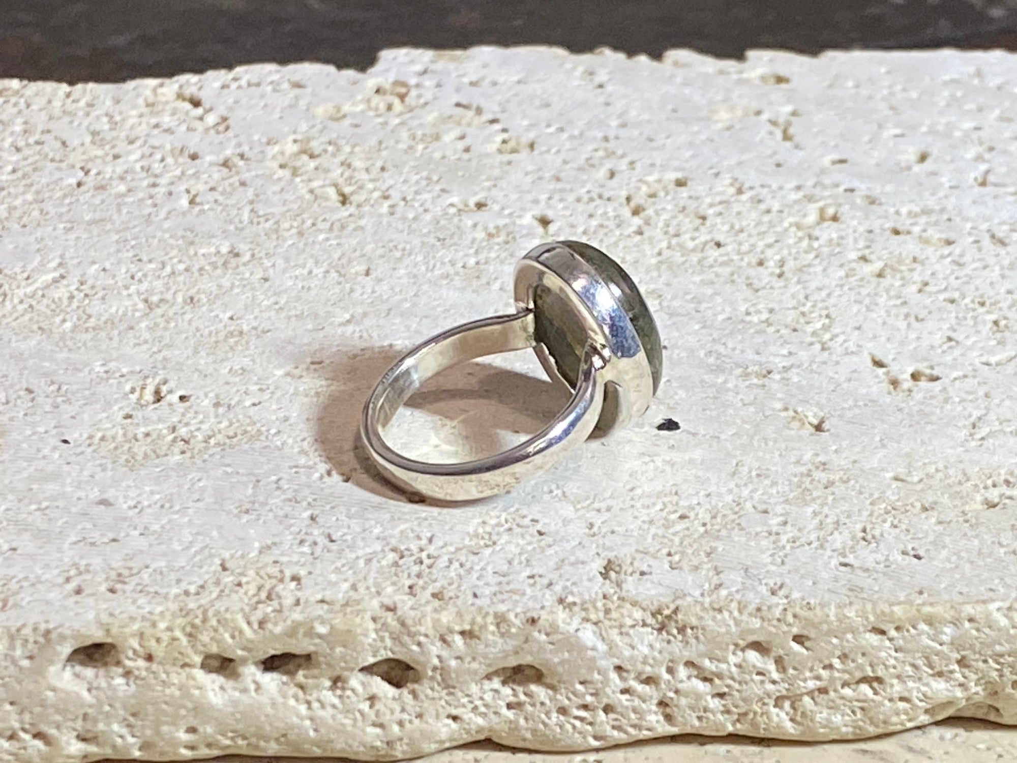 Round oval labradorite ring set in sterling silver. A high quality stone with deep blue fire.  Size 6