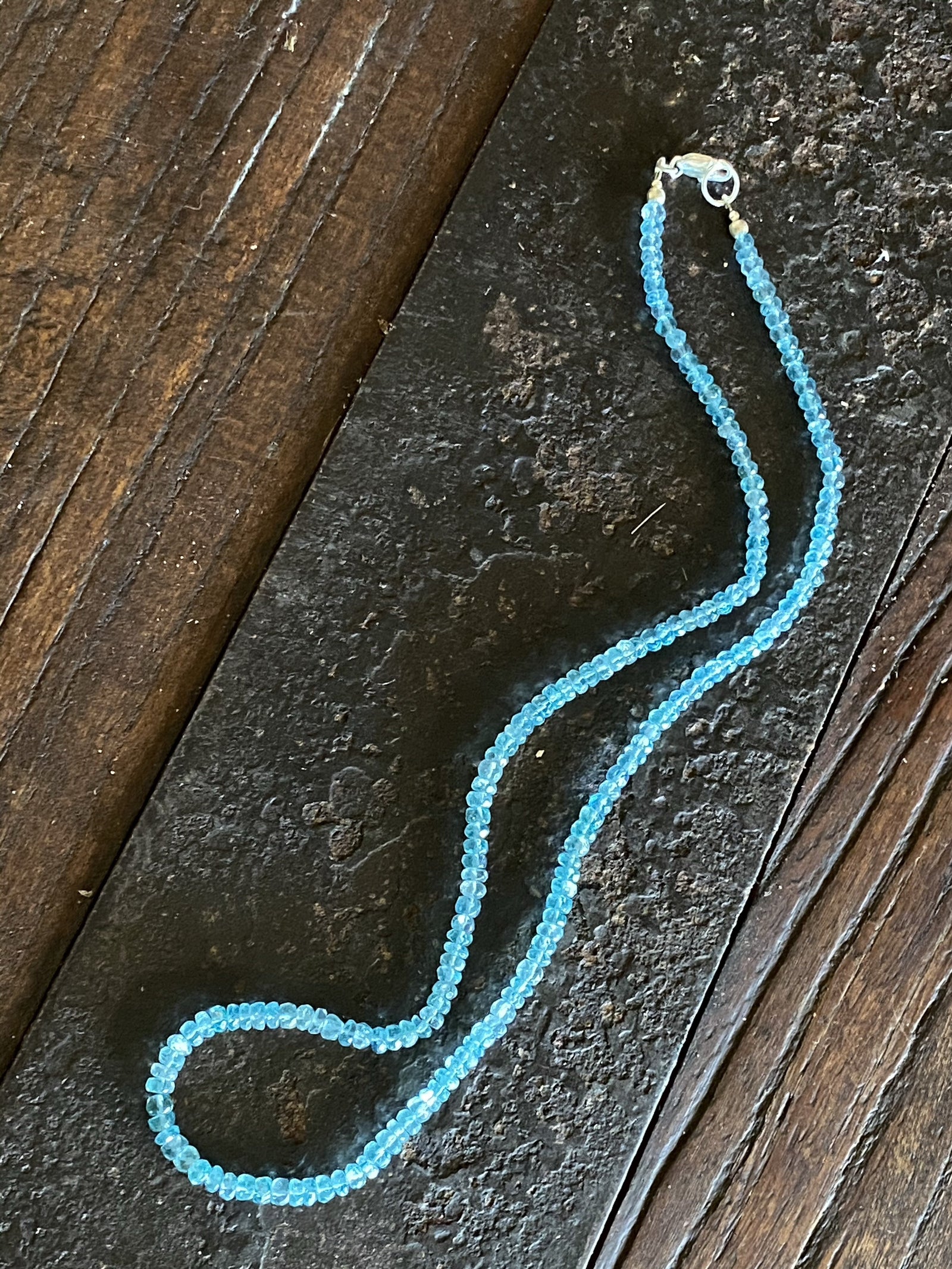 Light blue facet cut apatite bead necklace with sterling silver lobster clasp. The apatite is natural, not dyed or heat treated.