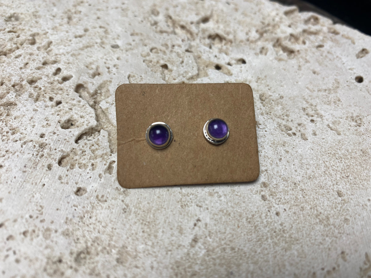 small amethyst earring studs are hand made from sterling silver