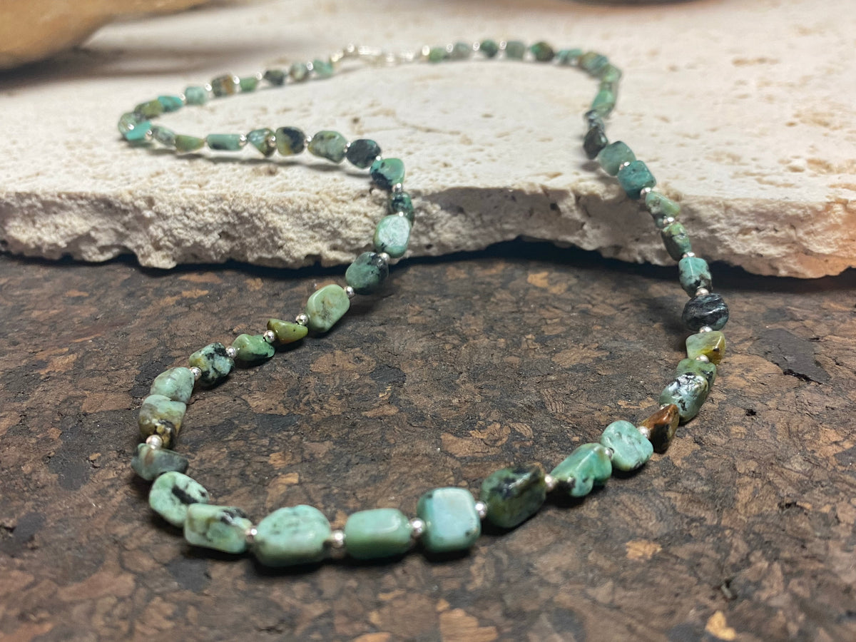 African turquoise boulder necklace with sterling silver bead highlighting