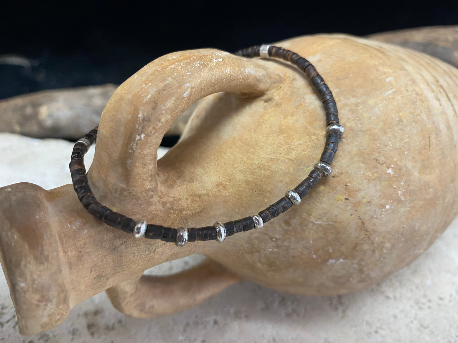 One of our signature coconut silver bracelets, crafted from polished coconut wood and hill tribe 95% silver., with sterling silver lobster clasp. A women's bracelet or a men's bracelet, it has a casual Boho vibe, and is made for that stacked bracelet look. Different sizes available