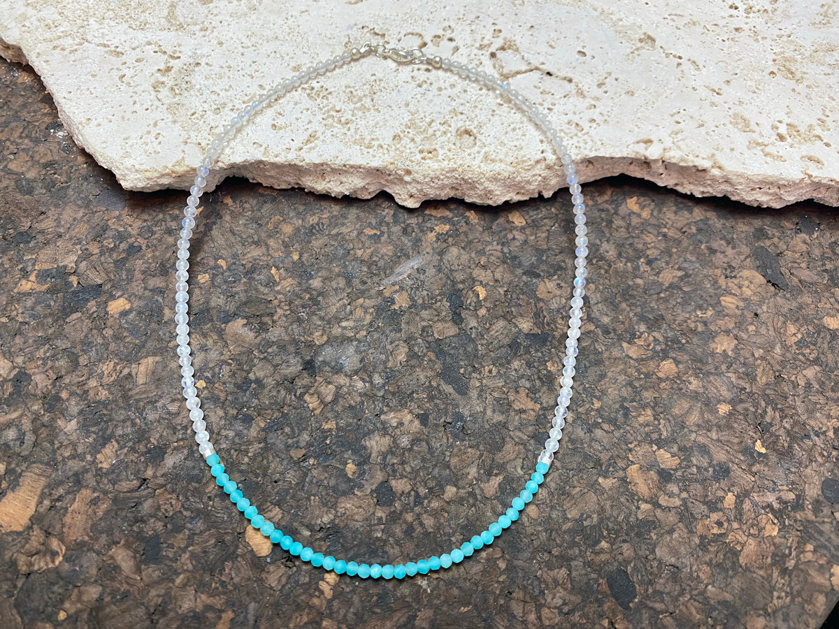 Our simple and bright choker necklace is made from rainbow moonstone and faceted amazonite beads, highlighted with sterling silver beads and a finished with a sterling silver mount and bail. Measurements: length 41 cm (16.25 in), bead diameter 2 mm