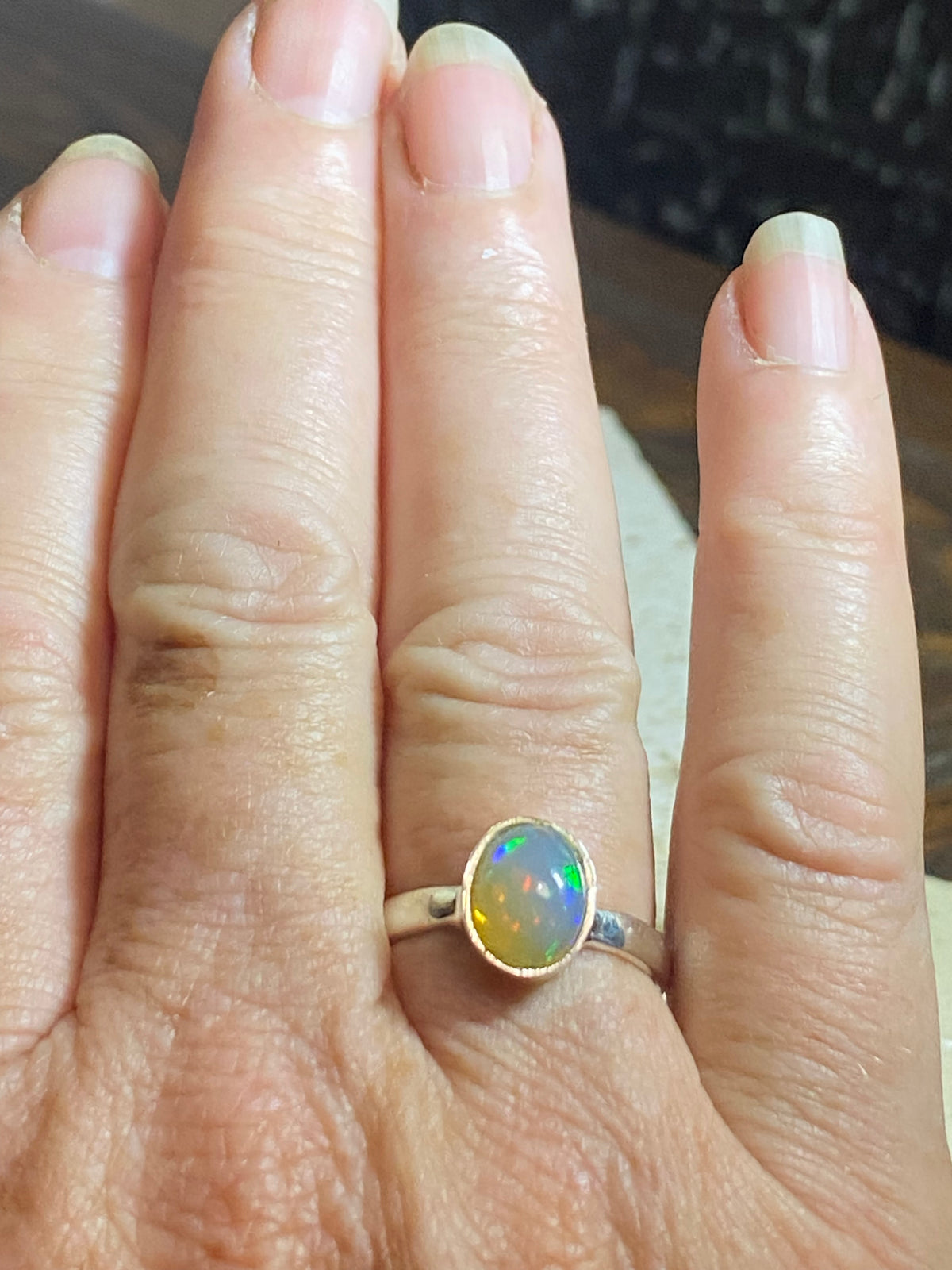 Opal ring set in heavy sterling silver. A stunning, high quality stone with excellent fire. Size 7.75