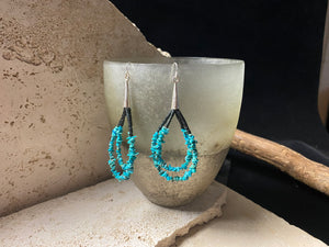 Beautiful southwest earrings made from turquoise chips and black serpentine stone, finished with sterling silver caps and hooks. Length 8.5 cm