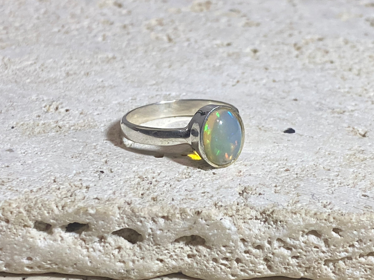 Opal ring set in heavy sterling silver. A stunning, high quality stone with excellent fire. Size 7.75