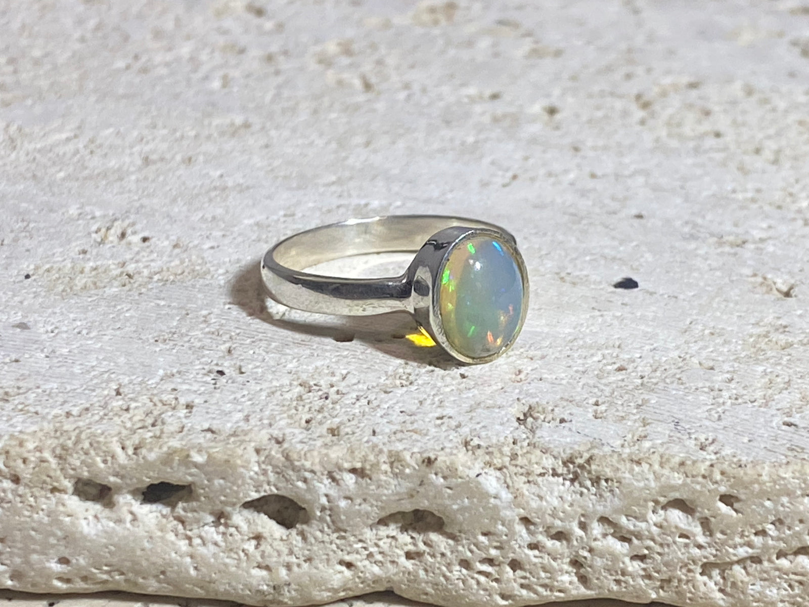 Opal ring set in heavy sterling silver. A stunning, high quality stone with excellent fire. Size 7.75