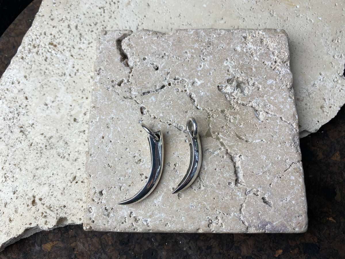 Simple sterling silver claw pendants, complete with large closed jump rings