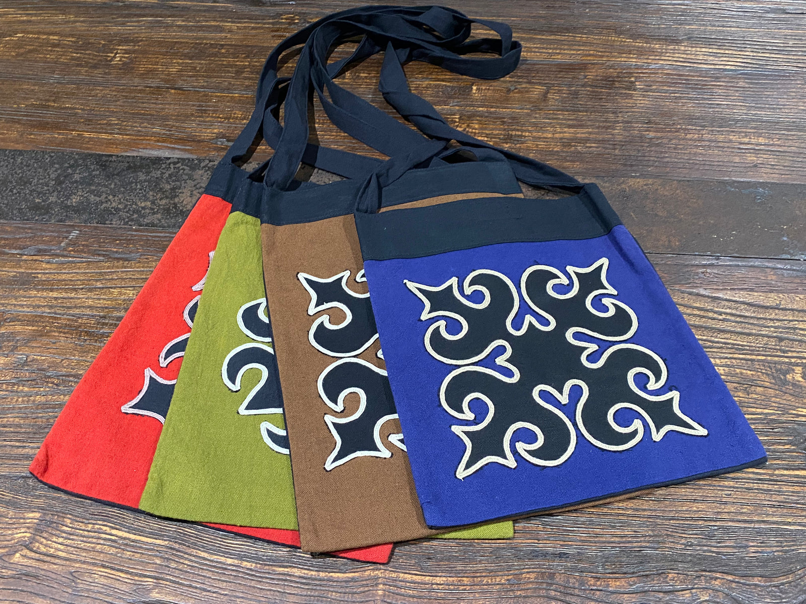 Yao hill tribe shoulder bags, stylish and practical, made from 100% cotton, with velcro tab fastening and zippered pocket inside.  Black backs and straps.  Measurements:  Height 34 x Width 25 cm  Strap height 52 cm