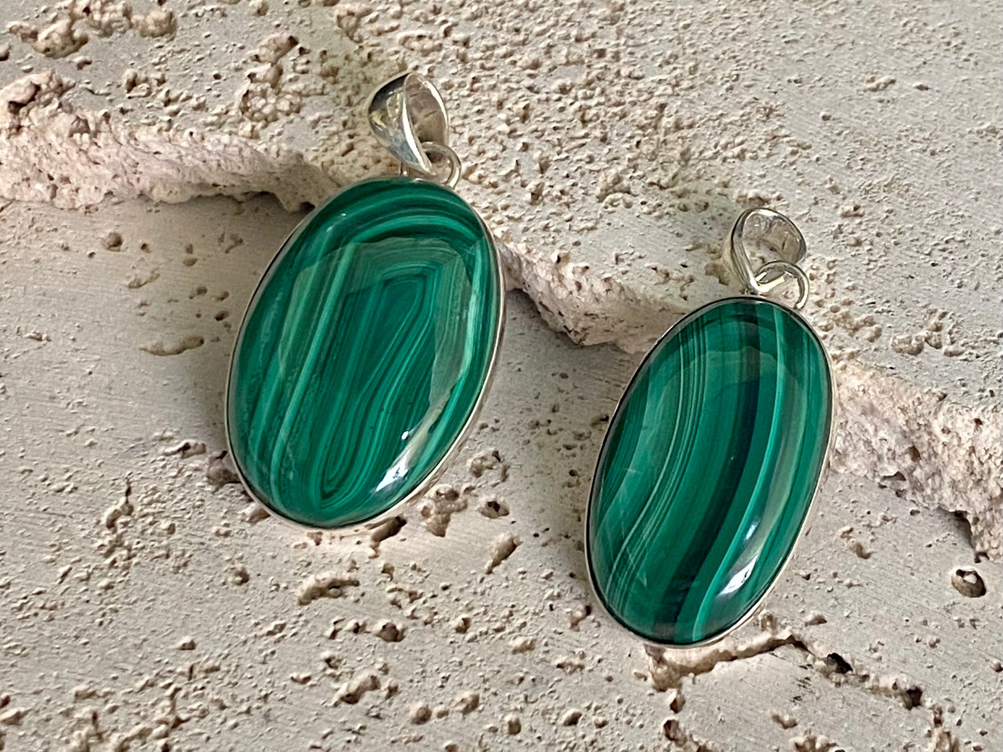 Oval malachite stone pendant set in sterling silver bezel surround, and large bail