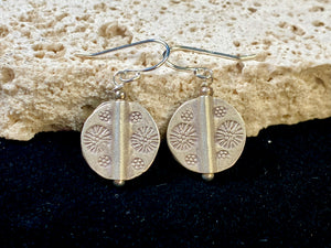 Our most popular earring. Karen hill tribe charms of high grade silver finished with sterling silver hooks.  Charm 1.5 cm diameter, earring length 2.8 cm including hook 