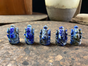 Hand carved from Afghan lapis lazuli, these small ganesh statues  are perfect for travelling, or if you're short on space, have only a small space to fill or like to keep Ganesh with you at all times. From 2.2  2.5 cm in height