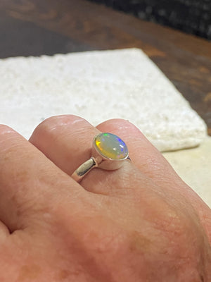 Opal ring set in heavy sterling silver. A stunning, high quality stone with excellent fire. Size 7.75