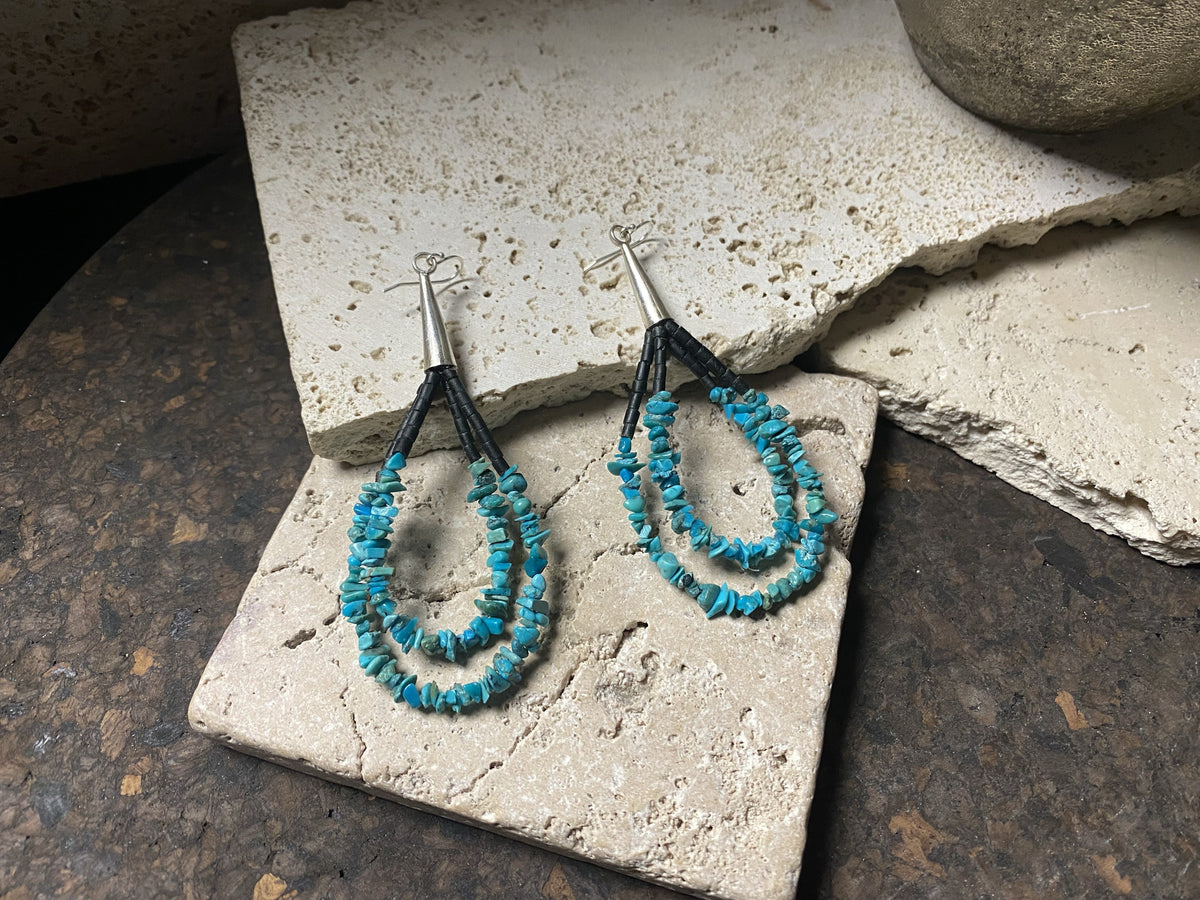 Beautiful southwest earrings made from turquoise chips and black serpentine stone, finished with sterling silver caps and hooks. Length 8.5 cm