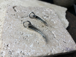 Simple sterling silver claw pendants, complete with large closed jump rings
