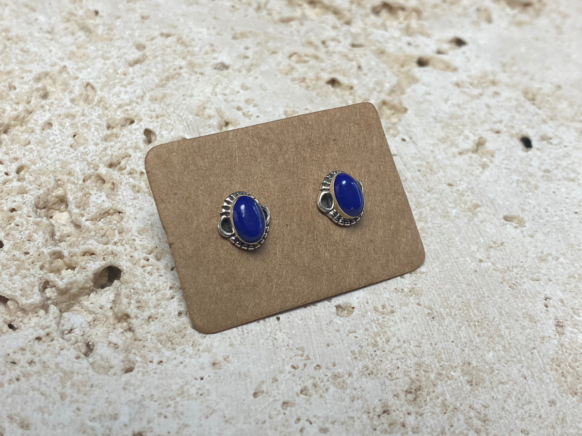 Simple and elegant, these small lapis lazuli earring studs are hand made from sterling silver and set with lapis cabochons