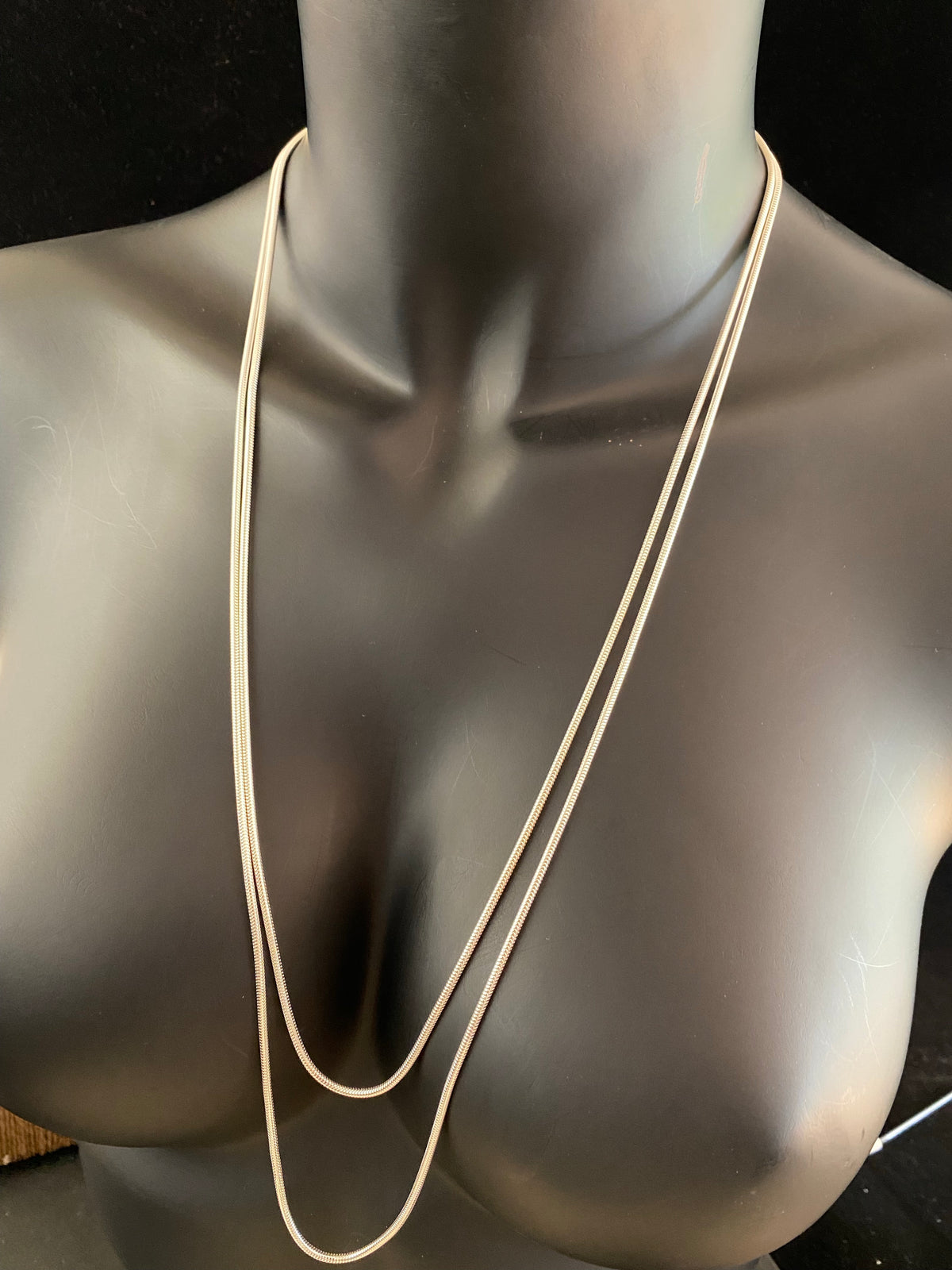 2.1 mm diameter snake chain in two lengths, these nickel-free chains are German-made from 93.5% silver and are tarnish-resistant. Our snake chain features a parrot clasp and is fitted with a narrow bail to ensure even the smallest of pendants will fit. Select Long 70 cm/28" or Very long - 80 cm/32"