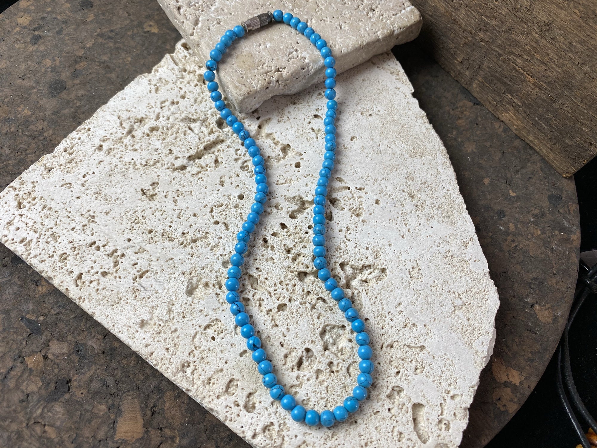Simple turquoise-look choker made from dyed howlite stone with a brass screw clasp