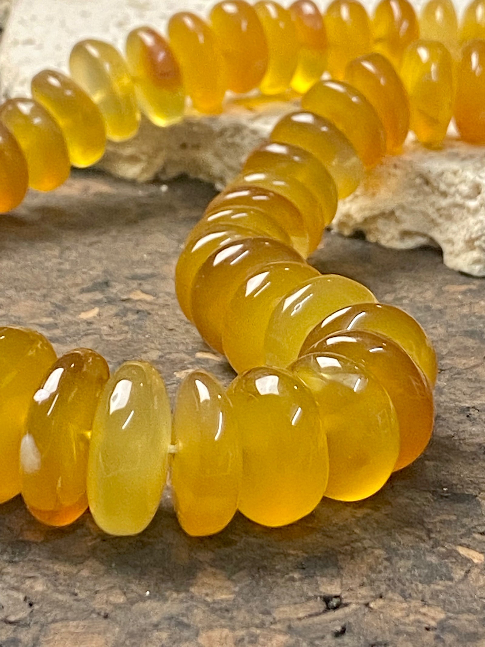 A beautiful necklace of polished graduated caramel onyx beads. Sterling silver clasp and detailing. This statement necklace is designed to impress, with the look of high quality amber without the price tag. length 51.5 cm