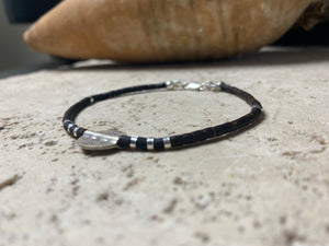 One of our signature coconut silver bracelets, crafted from polished coconut wood and hill tribe 95% silver., with sterling silver lobster clasp. A women's bracelet or a men's bracelet, it has a casual Boho vibe, and is made for that stacked bracelet look. Different sizes available