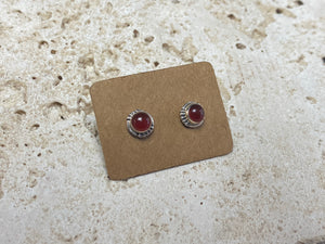 Simple and elegant, these small carnelian earring studs are hand made from sterling silver and set with natural carnelian cabochon stones