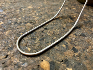 fine sterling silver snake chain is densely woven and strong, with a bright silver finish and ring clasp