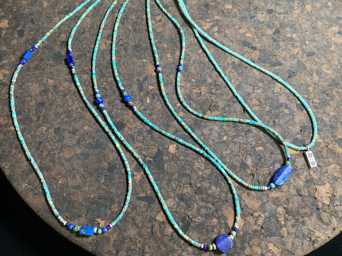 Fine beaded lapis and turquoise necklaces made from tiny tubes of turquoise, highlighted with lapis, African jasper and sterling silver. Our unisex necklaces are perfect for either men or women.