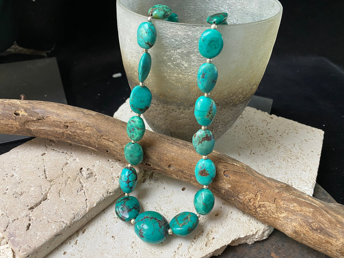 Stunning natural turquoise necklace featuring sterling silver beads and fastening. A unique tribal inspired necklace with a luxurious Boho vibe Measurements: 44 cm length including clasp