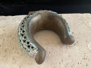 Vintage African Benin trade currency bronze bracelet. From Cameroon, Africa.  This very attractive, large bronze bracelet has an attractive green and brownish patina and is beautifully cast with fine detailing. Width 12.8 cm