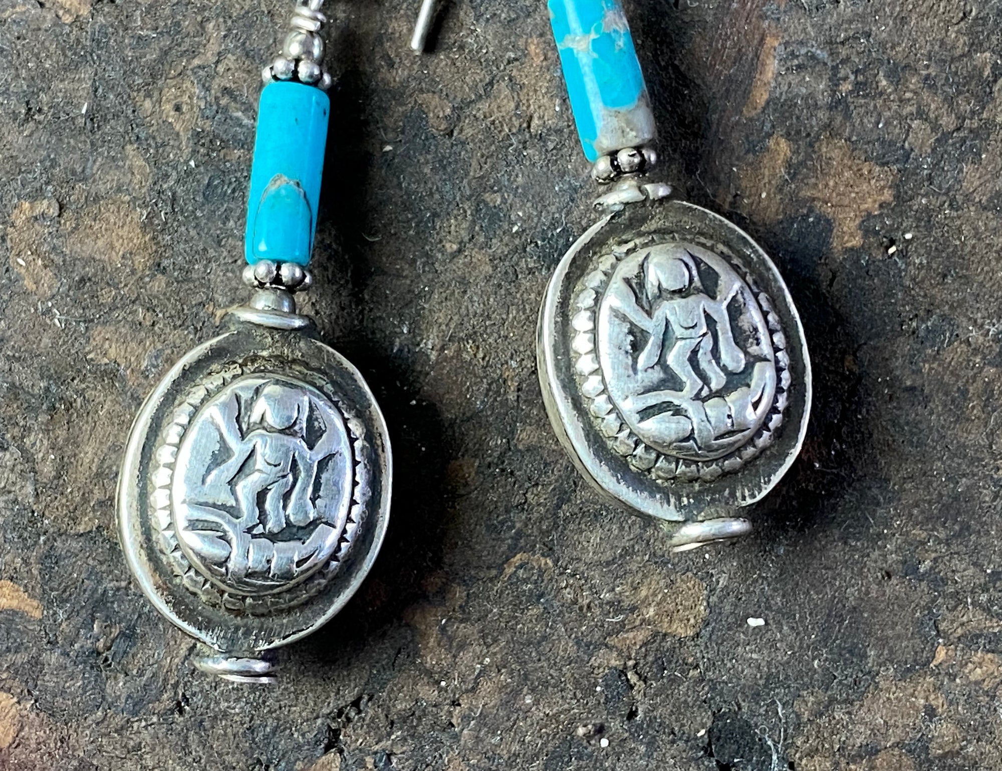 Unique statement earrings featuring genuine turquoise and vintage silver beads from india featuring an image of Lakshmi, goddess of wealth and prosperity