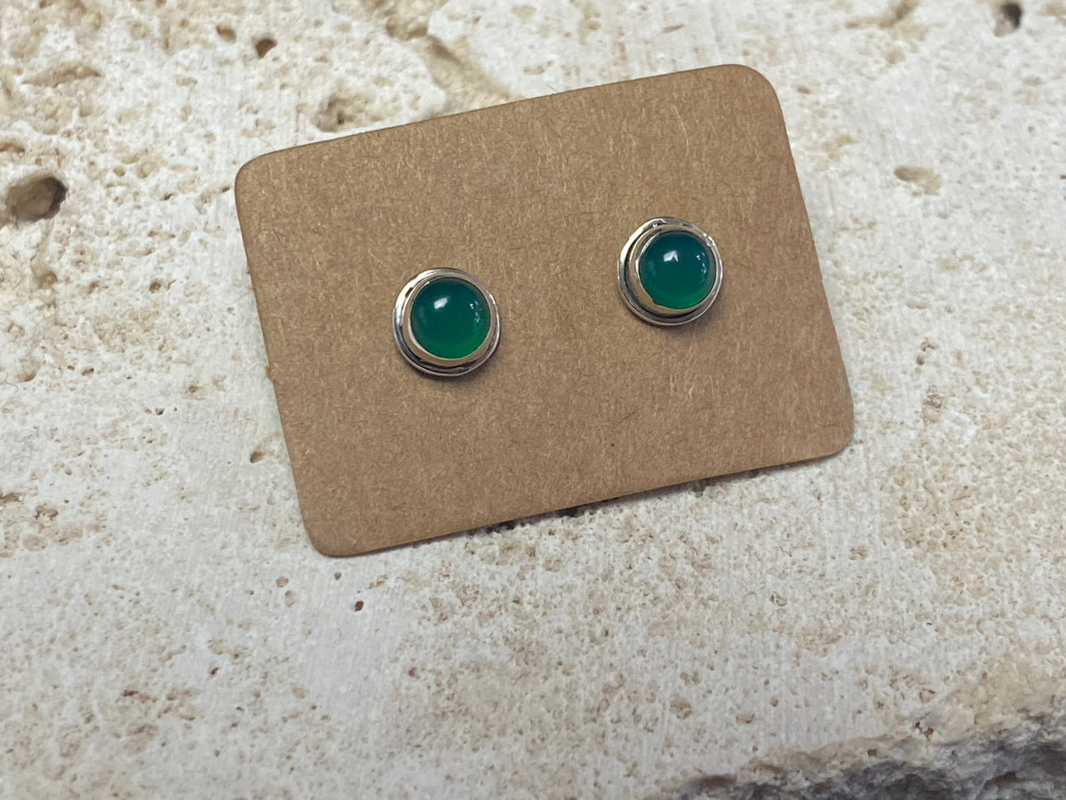 Small chrysoprase earring studs are hand made from sterling silver and set with clear green chrysoprase cabochons. A unisex earring
