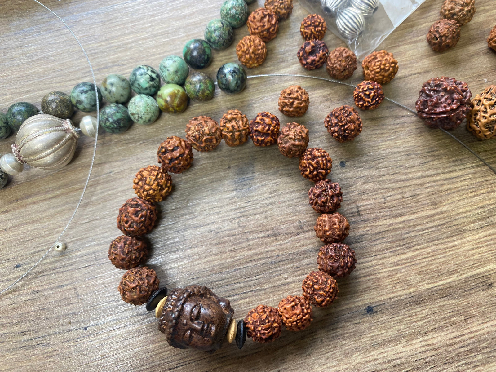 carved wood Buddha and rudraksha seed bracelet, 30 cm length