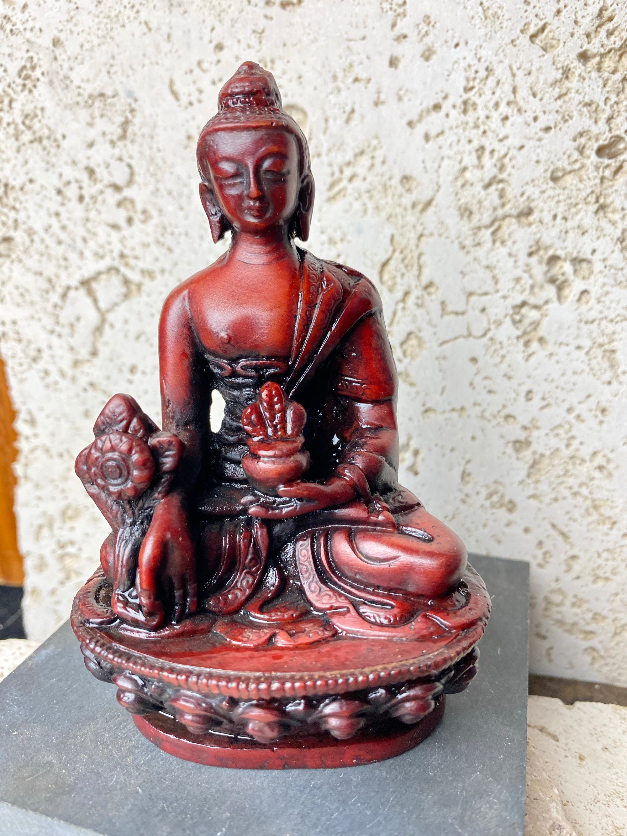Buddha statues cast from high-quality resin and finished by hand. From a Tibetan artisan exiled in Nepal. Each statue features flowing robes, while free hands cradle the begging bowl.  Each buddha statue is 11 cm