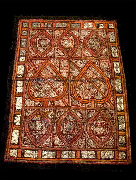 Traditional Sind Desert tribal textile, made up of many panels of embroidery with heavy silver thread and small mirrors to produce a stunningly cohesive effect that is traditionally called zari work or zari embroidery. Full lined at the back with red cotton and bordered with black cotton. From northwest India. Approximately 50-60 years old.  Measurements: 173 cm x 134 cm